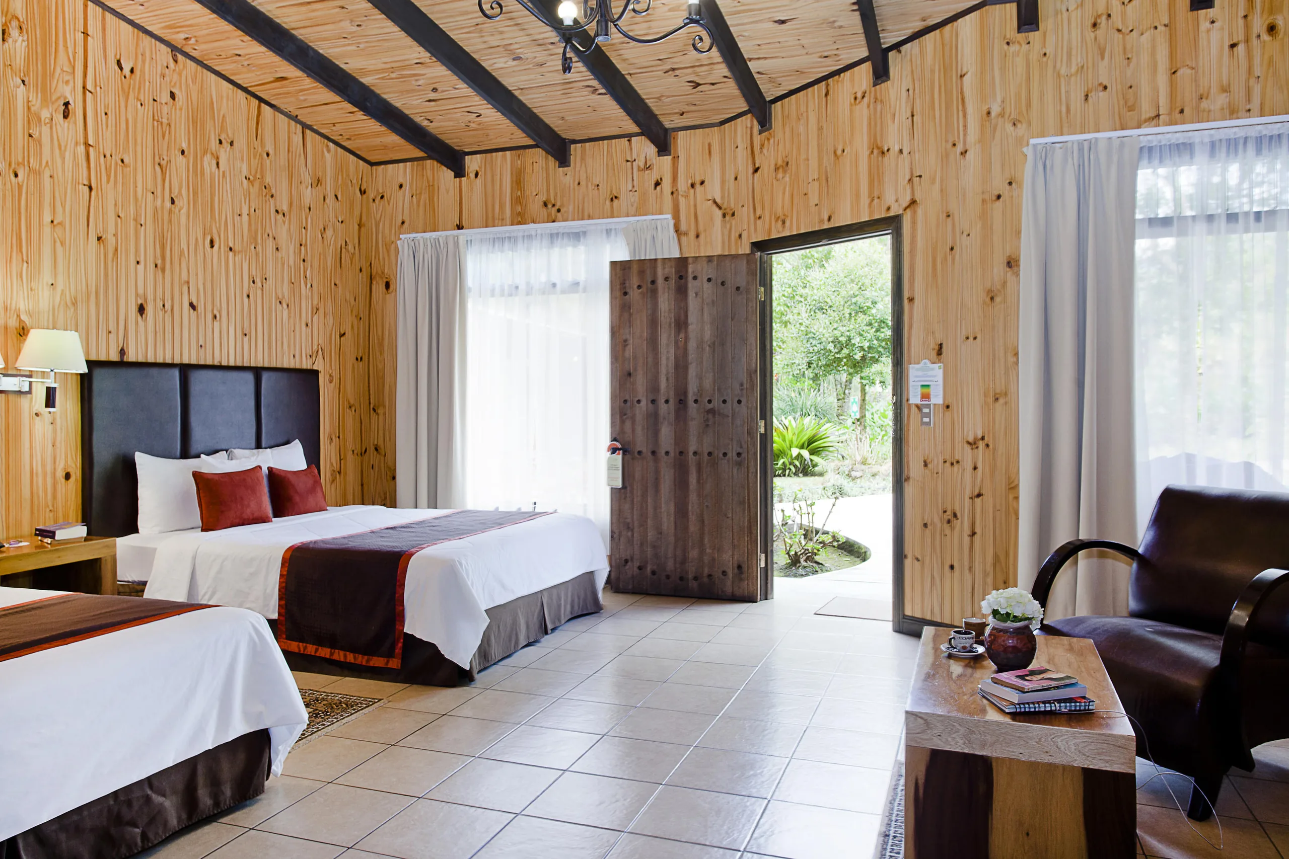 Junior Suite with two queen beds and the door open to the garden